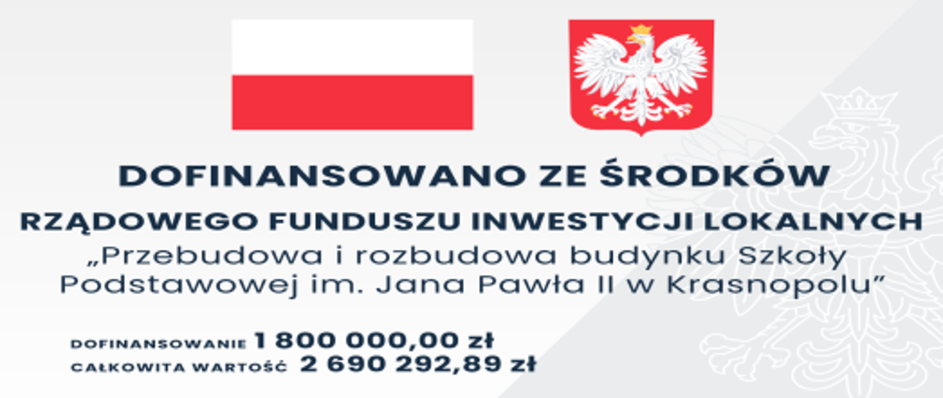 Na górze flaga i godło RP. Poniżej napis DOFINANSOWANO ZE ŚRODKÓW RZĄDOWEGO FUNDUSZU INWESTYCJI LOKALNYCH „Przebudowa i rozbudowa budynku Szkoły Podstawowej im. Jana Pawła II w Krasnopolu" DOFINANSOWANIE = 1800000,00 zł CAŁKOWITA WARTOŚĆ INWESTYCJI = 2690292,89 zł