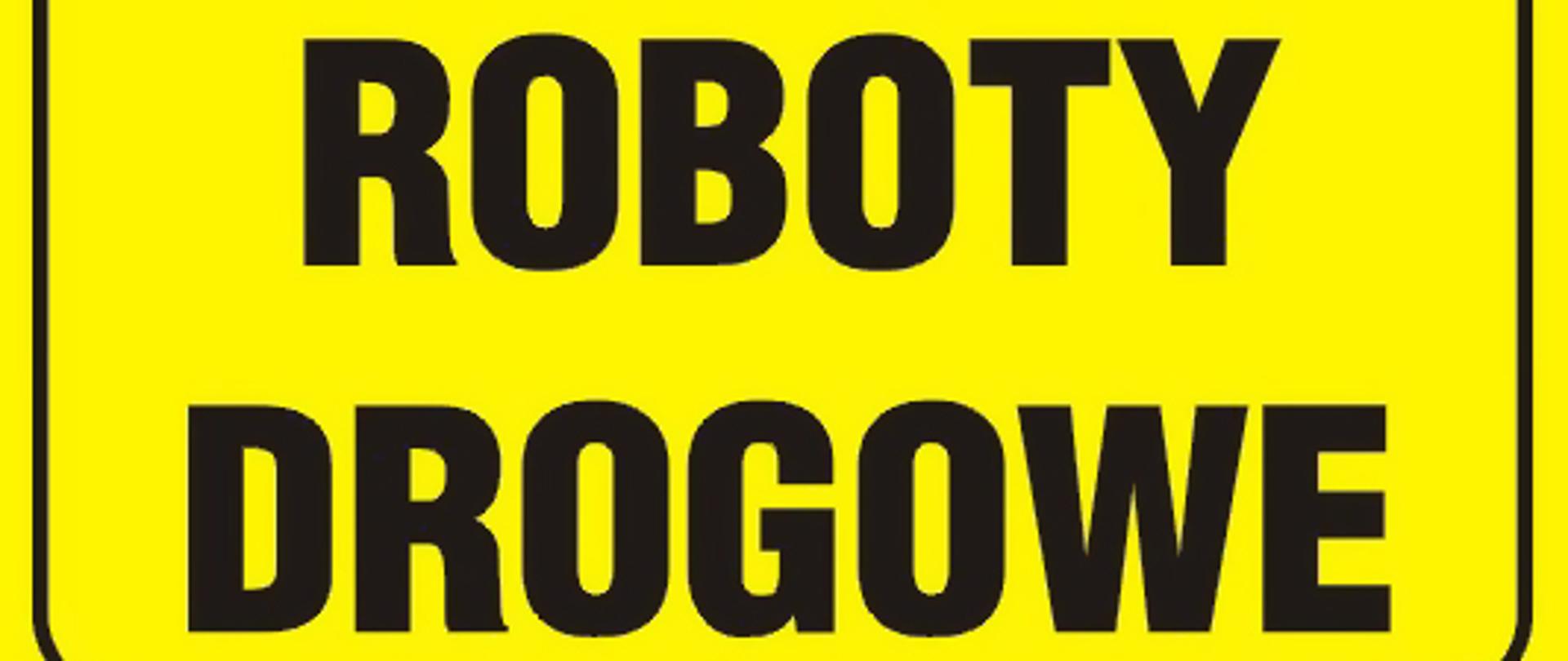 napis na żółtym tle UWAGA ROBOTY DROGOWE
