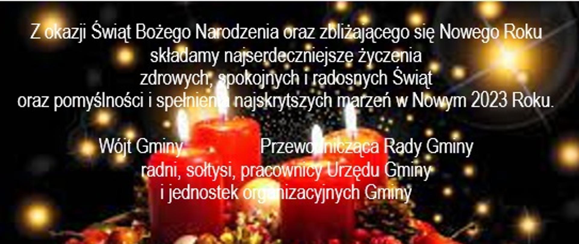 na tle stroika z płonącymi czerwonymi świecami życzenia, które znajdują się również poniżej w treści 