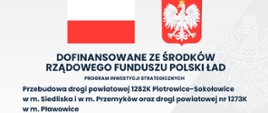Tablica informacyjna dotycząca przebudowy drogi powiatowej 1282K Piotrowice- Sokołowice w miejscowości Siedliska i w miejscowości Przemyków oraz drogi powiatowej nr 1273K w miejscowości Pławowice. 