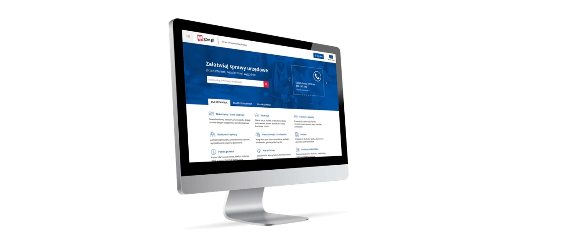 Srebrno-czarny monitor komputerowy z wyświetloną witryną gov.pl.