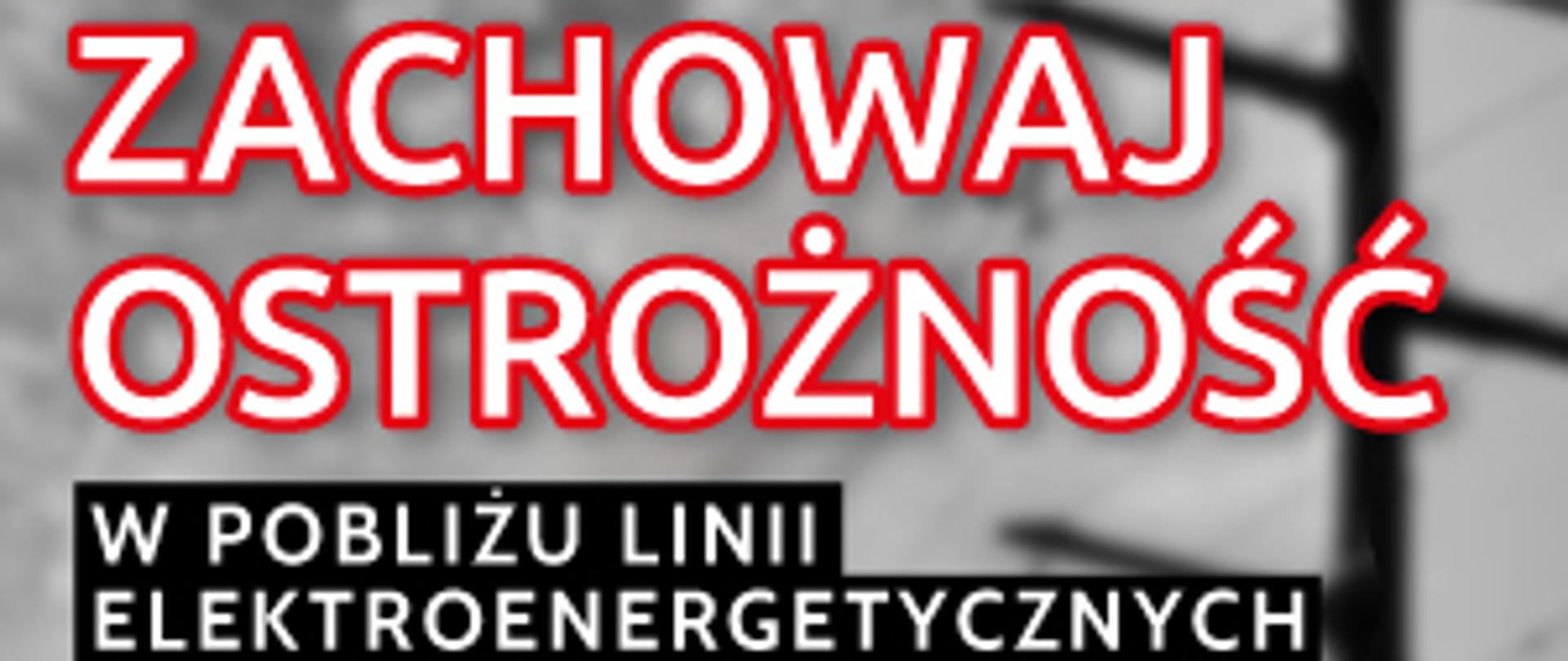 Napis ostrzegawczy Zachowaj ostrożność w pobliżu linii elektroenergetycznych