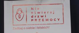 Plakat - obrazek domu , w oknie rodzina, u góry napis: "nie otwieraj drzwi przemocy"