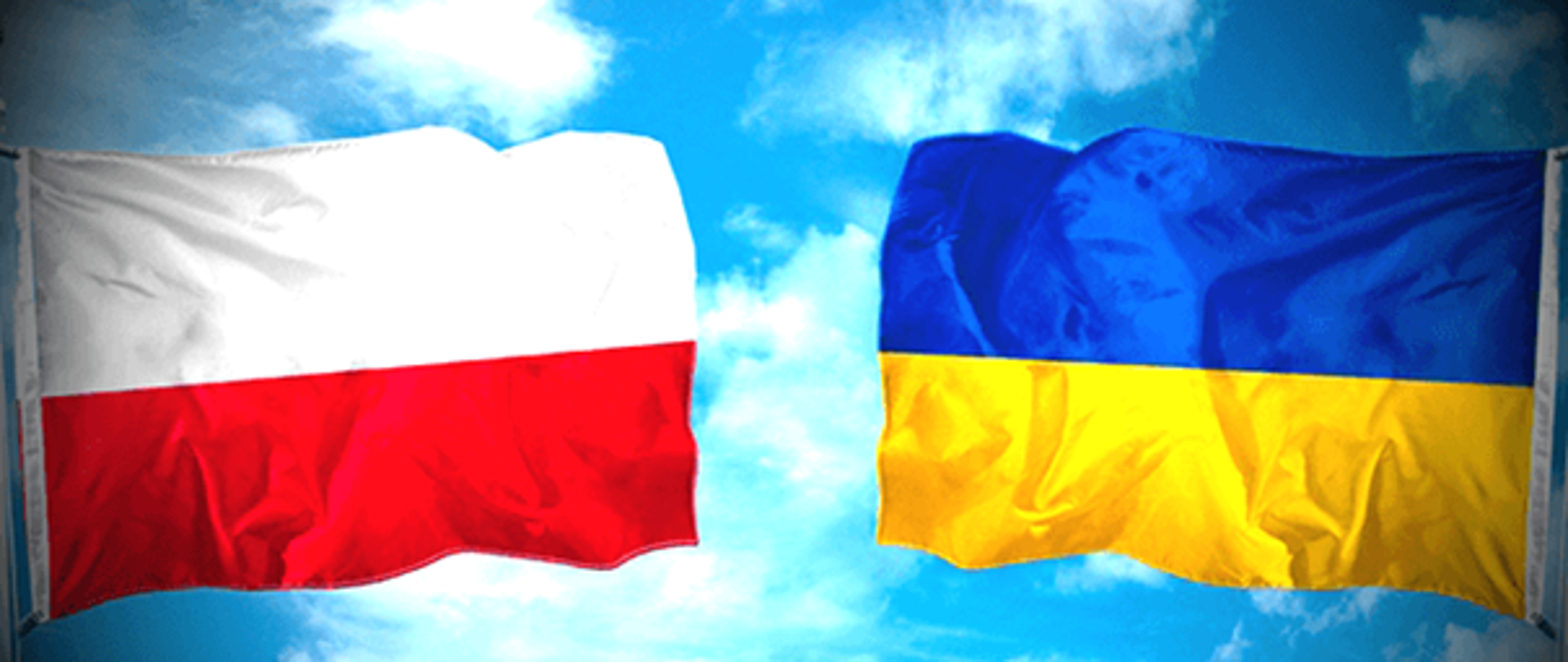 na tle nieba flagi Polski oraz Ukrainy