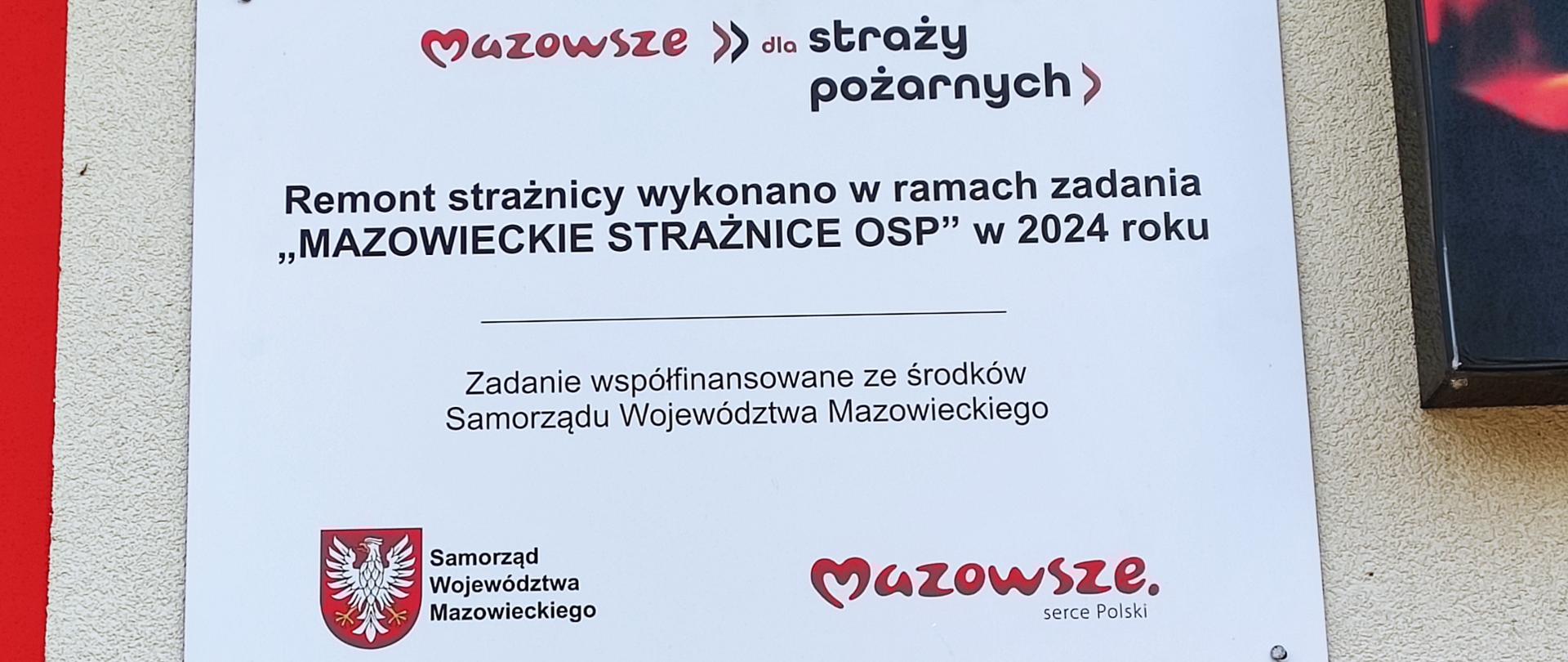 na ścianie strażnicy tablica" Mazowsze dla Straży Pożarnych Remont strażnicy wykonano w ramach zadania Mazowieckie Strażnice OSP w 2024 roku" Zadanie współfinansowane ze środków Samorządu Województwa Mazowieckiego"