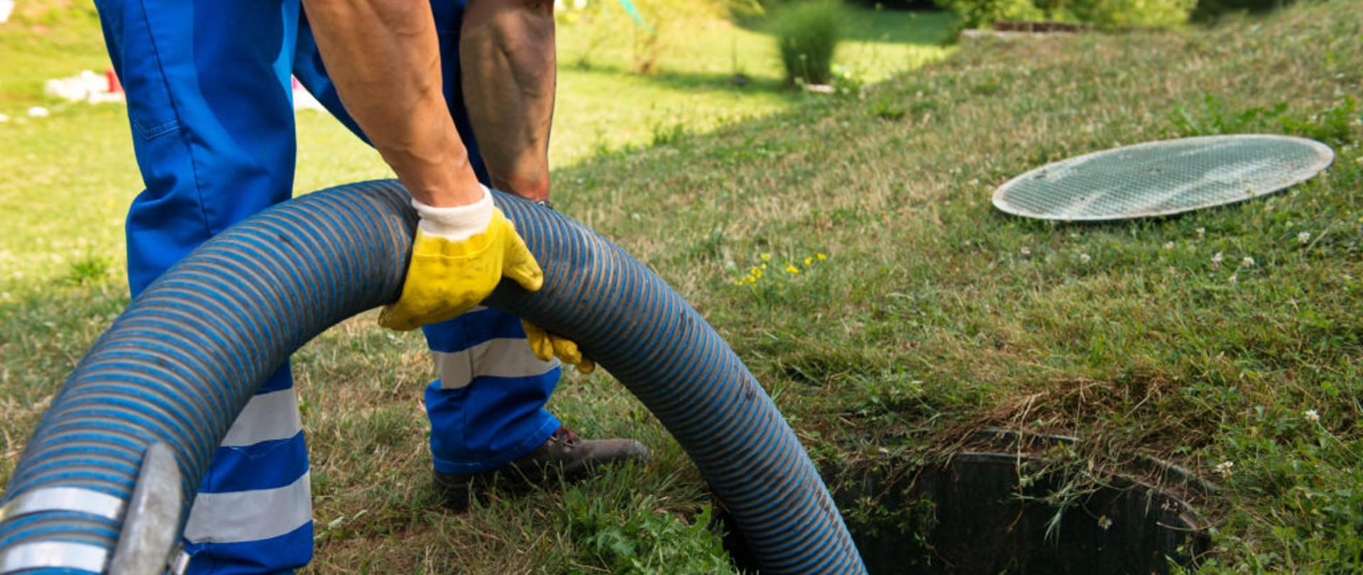 Emptying household septic tank. Cleaning sludge from septic system.