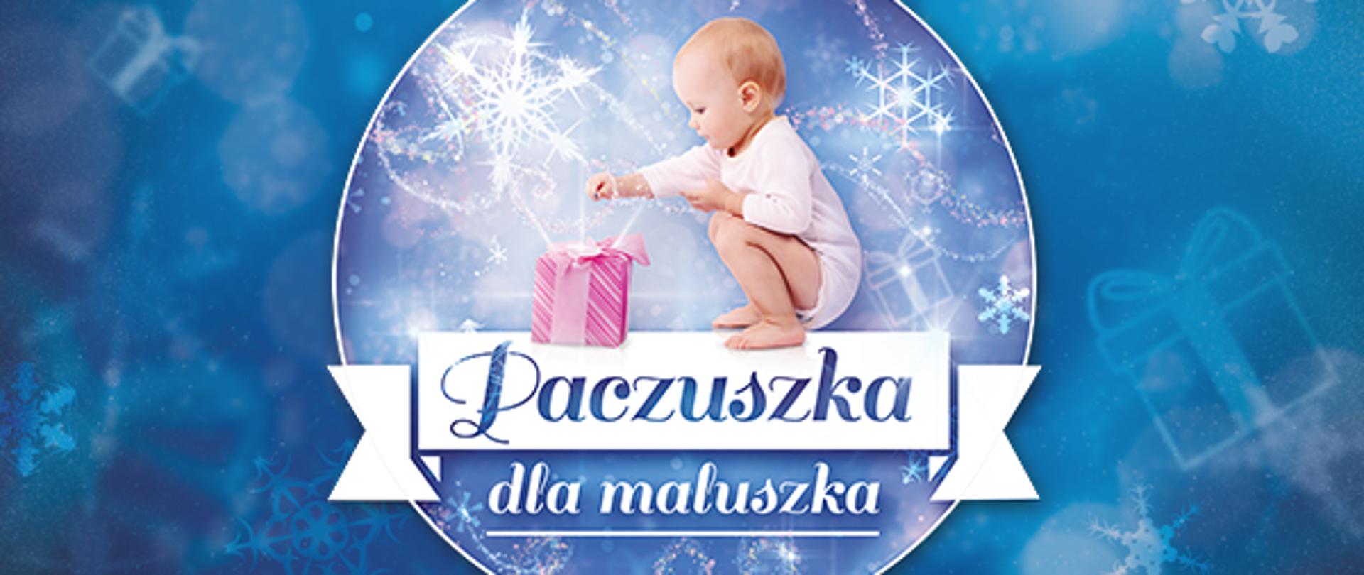 Logo akcji Paczuszka dla Maluszka. Na obrazku nazwa akcji, a nad nim małe dziecko sięgające po leżącą przed nim paczuszkę