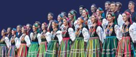 Koncert kolęd i pastorałek Zespołu "Mazowsze" - plakat. Na plakacie członkowie Zespołu Mazowsze w barwnych, ludowych strojach plus informacje: Krzysztof Rymuza Starosta Pruszkowski i Rafał Sieradzki Przewodniczący Rady Powiatu Pruszkowskiego z wielką radością zapraszają wszystkich mieszkańców powiatu pruszkowskiego na koncert najpiękniejszych 🌲🎁🌲kolęd i pastorałek w wykonaniu Państwowego Zespołu Ludowego Pieśni i Tańca "Mazowsze".
🎶„Bóg się rodzi”, „W żłobie leży”, „Lulajże Jezuniu” m.in. te kolędy wypełnią 𝟲 𝘀𝘁𝘆𝗰𝘇𝗻𝗶𝗮, 𝗼𝗱 𝗴𝗼𝗱𝘇. 𝟭𝟵:𝟬𝟬 parafię pod wezwaniem Św. Józefa, przy ulicy Helenowskiej 3 w Pruszkowie.
Piękne aranżacje i kunsztowne wykonanie na pewno sprawią, że koncert „Mazowsza” będzie niesamowitym przeżyciem i zatrzyma z nami jeszcze przez chwilę 🌟magię świąt Bożego Narodzenia – 𝘇𝗮𝗽𝗿𝗮𝘀𝘇𝗮𝗺𝘆 𝘀𝗲𝗿𝗱𝗲𝗰𝘇𝗻𝗶𝗲!
