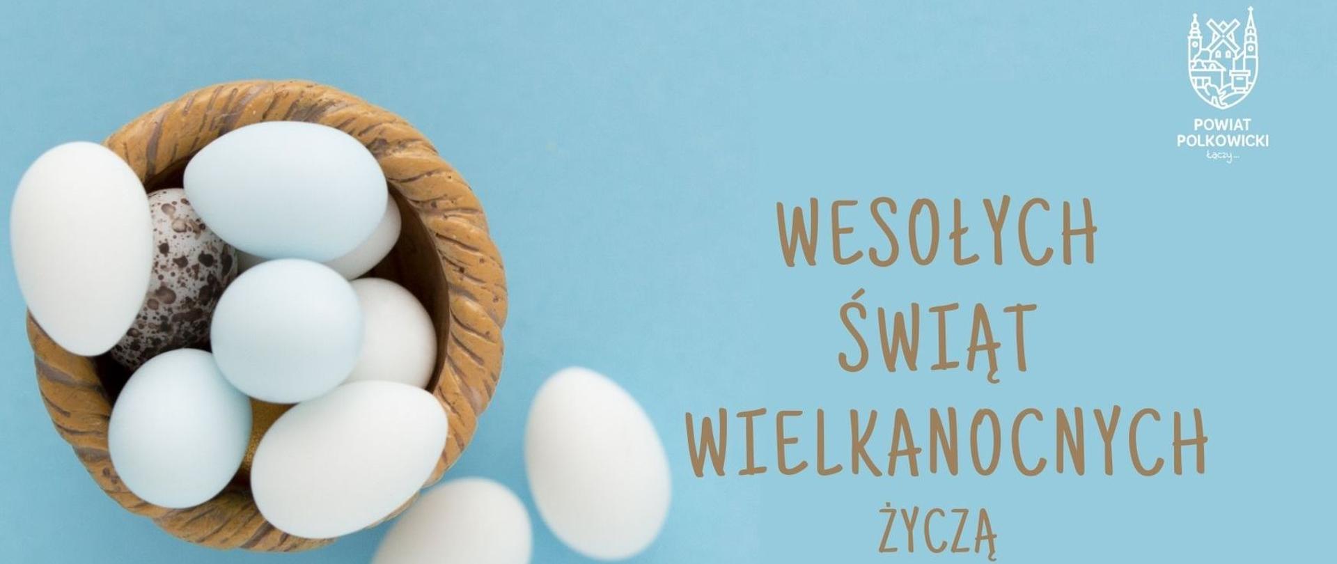 Białe jajka w koszyczku z życzeniami Wesołych Świąt Wielkanocnych życzą Henryk Czekajło Przewodniczący Rady Powiatu, Kamil Ciupak Starosta Polkowicki. W prawym górnym rogu znajduje się logo powiatu.