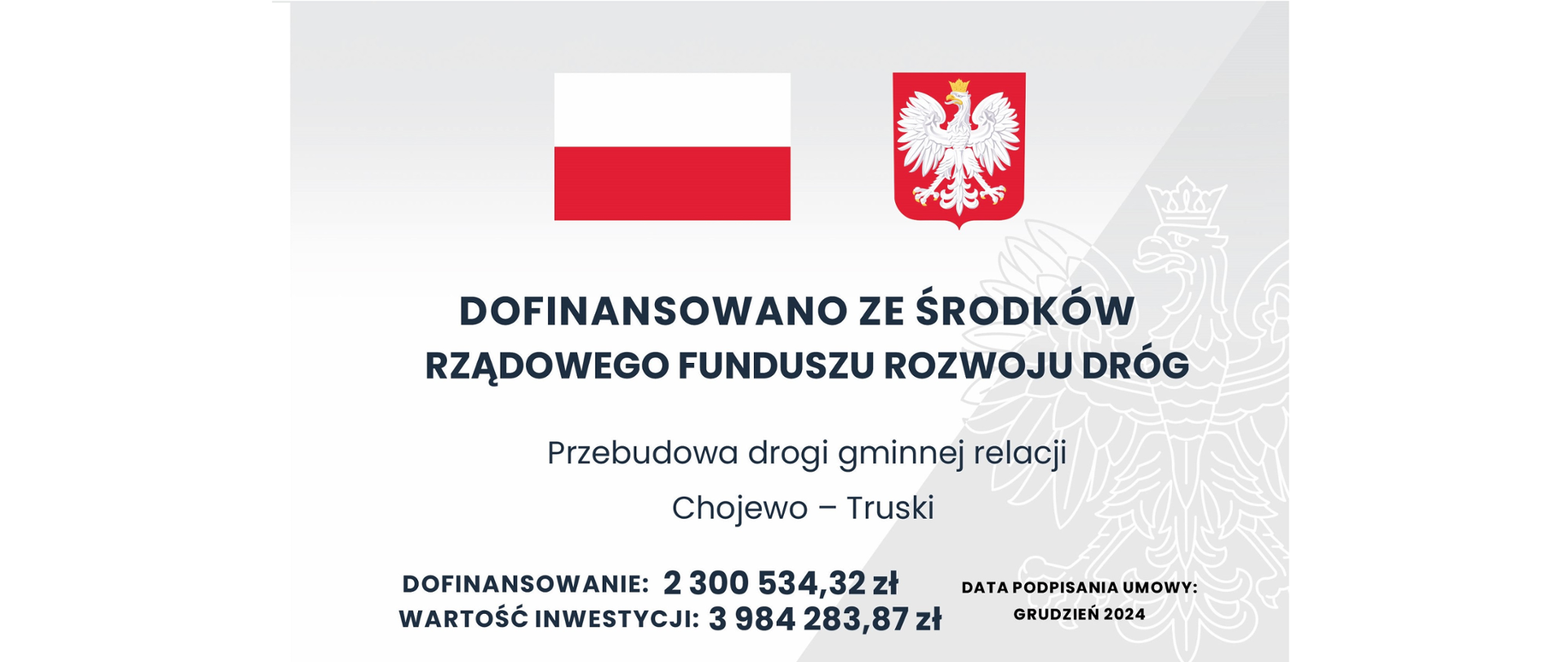Tablica informacyjna dot. dofinansowania ze środków Rządowego Funduszu Rozwoju Dróg na zadanie pn.: "Przebudowa drogi gminnej relacji Chojewo- Truski". W dolnej części tablicy widnieje informacja o dofinansowaniu (2 300 534,32 zł), wartości inwestycji (3 984 283,87 zł) oraz dacie podpisania umowy (grudzień 2024 rok)