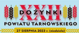 grafika przedstawia na błękitnym tle kłosy zboża w kolorach: czerwonym, czarnym i żółtym po lewej i prawej stronie. W środku znajduje się napis XXII Dożynki Powiatu TARnowskiego oraz data 27 sierpnia 2023 r. (niedziela)