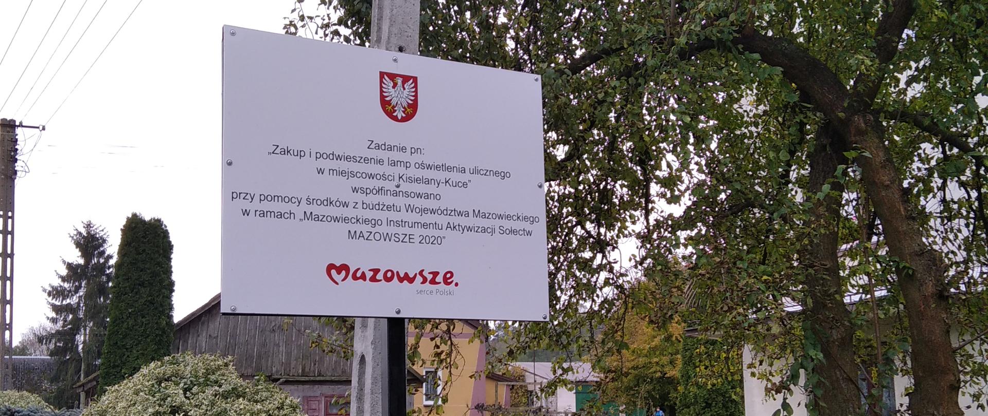 Podwieszenie lamp oświetlenia ulicznego w miejscowości Kisielany-Kuce