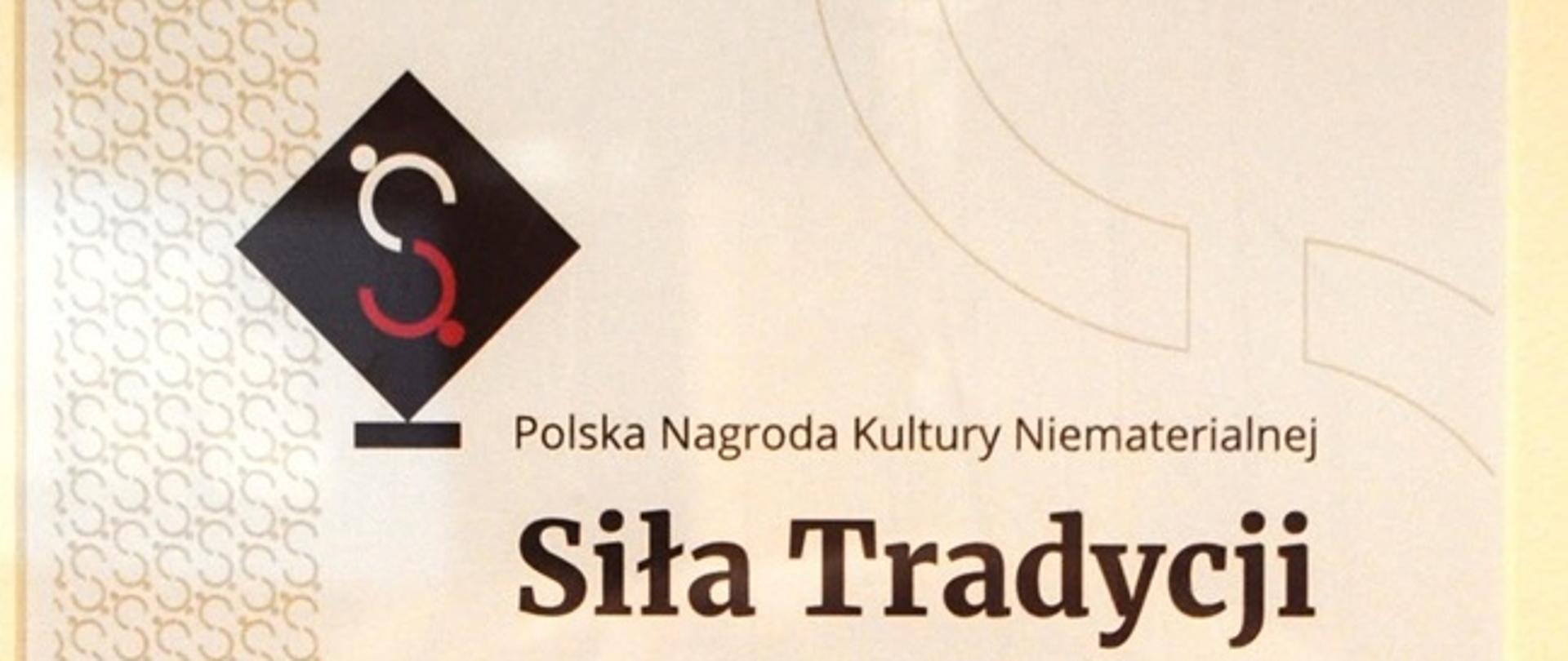 Oprawiony dyplom nominacji do Polskiej Nagrody Kultury Niematerialnej „Siła Tradycji” dla Ośrodka Kultury im. Zofii Trzynieckiej w Grodzisku Dolnym za projekt „Turki idą”.