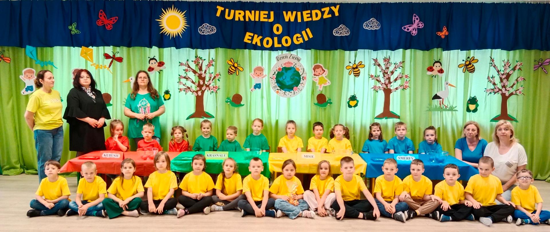 5 kobiet i dzieci na tle napisu TURNIEJ WIEDZY O EKOLOGII